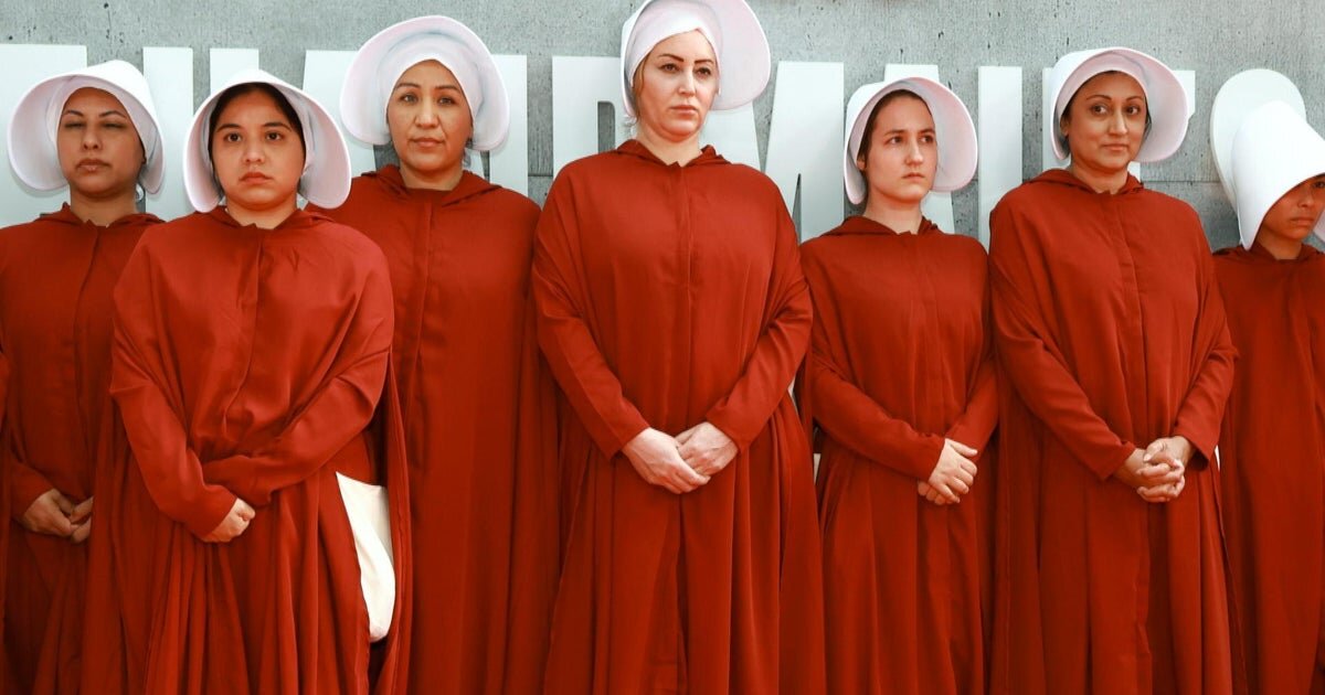 What inspired the outfits in Margaret Atwood's "The Handmaid's Tale