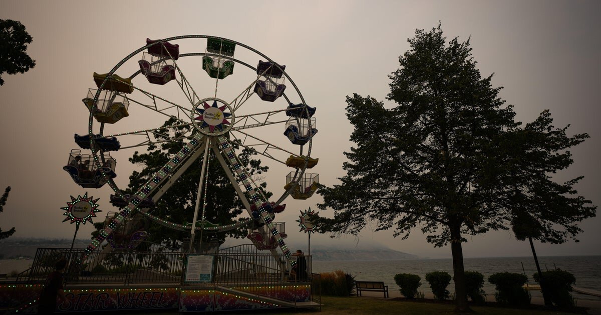 Wildfires rage, force evacuations in western U.S., Canada amid drought