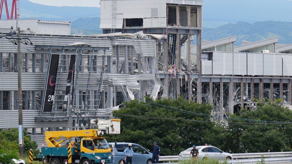 Rescuers search for survivors after powerful quake kills at least 18 in southwestern Japan