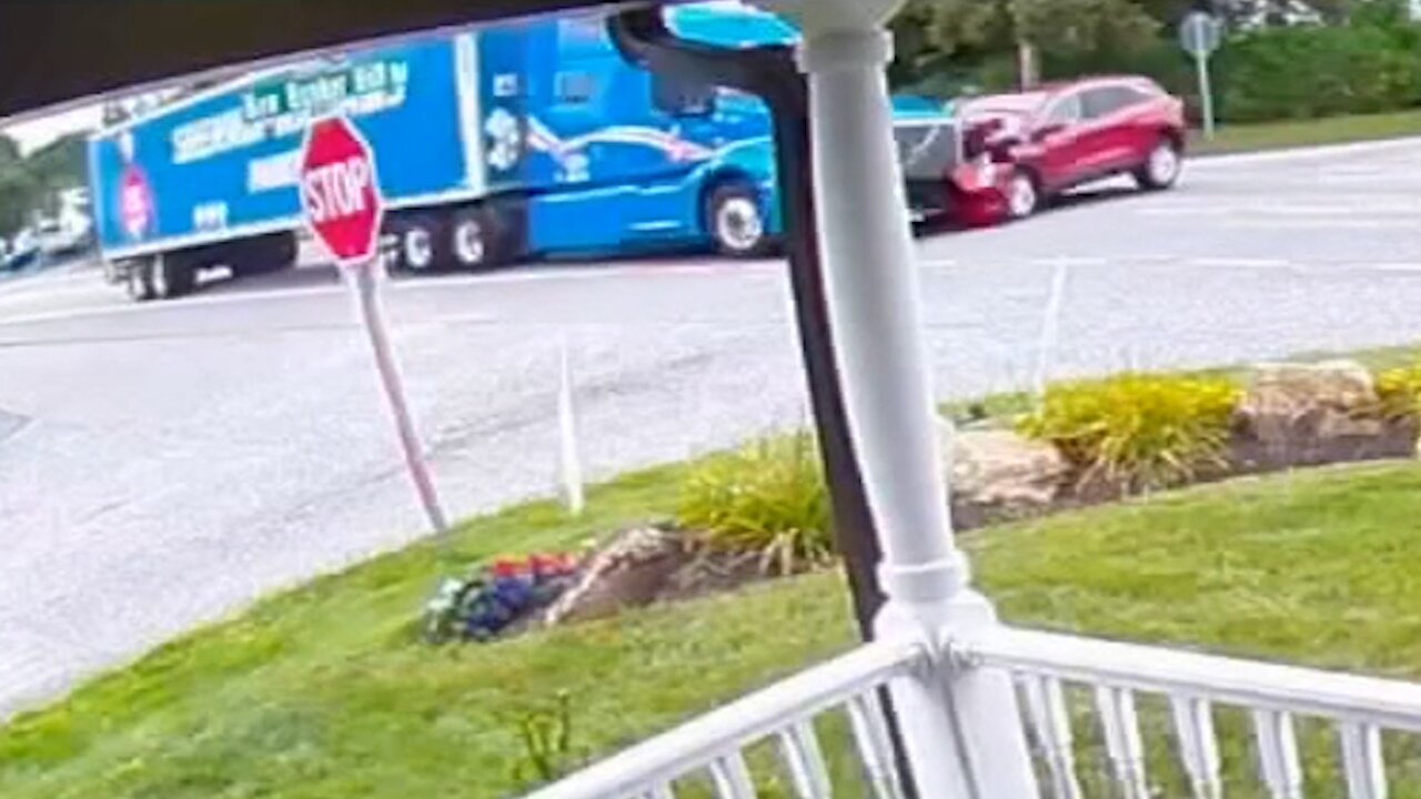 Dramatic crash sends tractor-trailer into garage, video shows