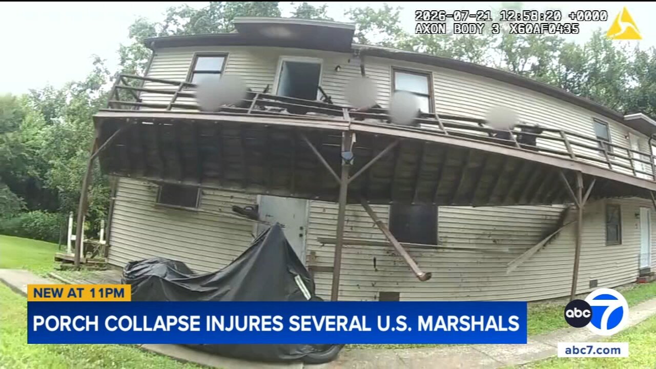 US Marshals fall as second-story deck collapses while they try to make an arrest, video shows