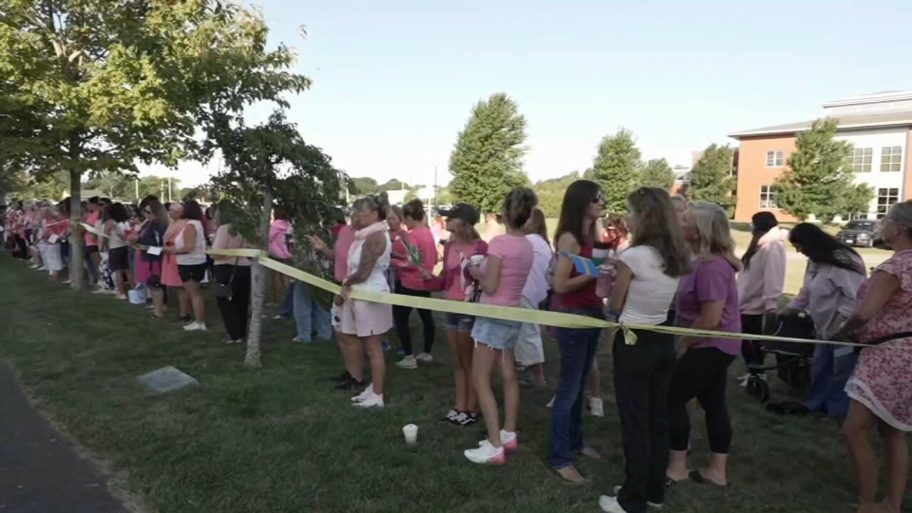 Women in pink rally in support of Lindsay Clancy who is on trial for killing 3 children