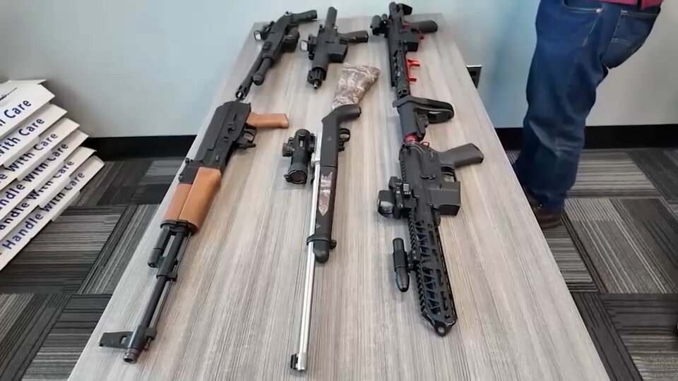 Nearly two dozen illegal guns, drugs seized from Long Beach home