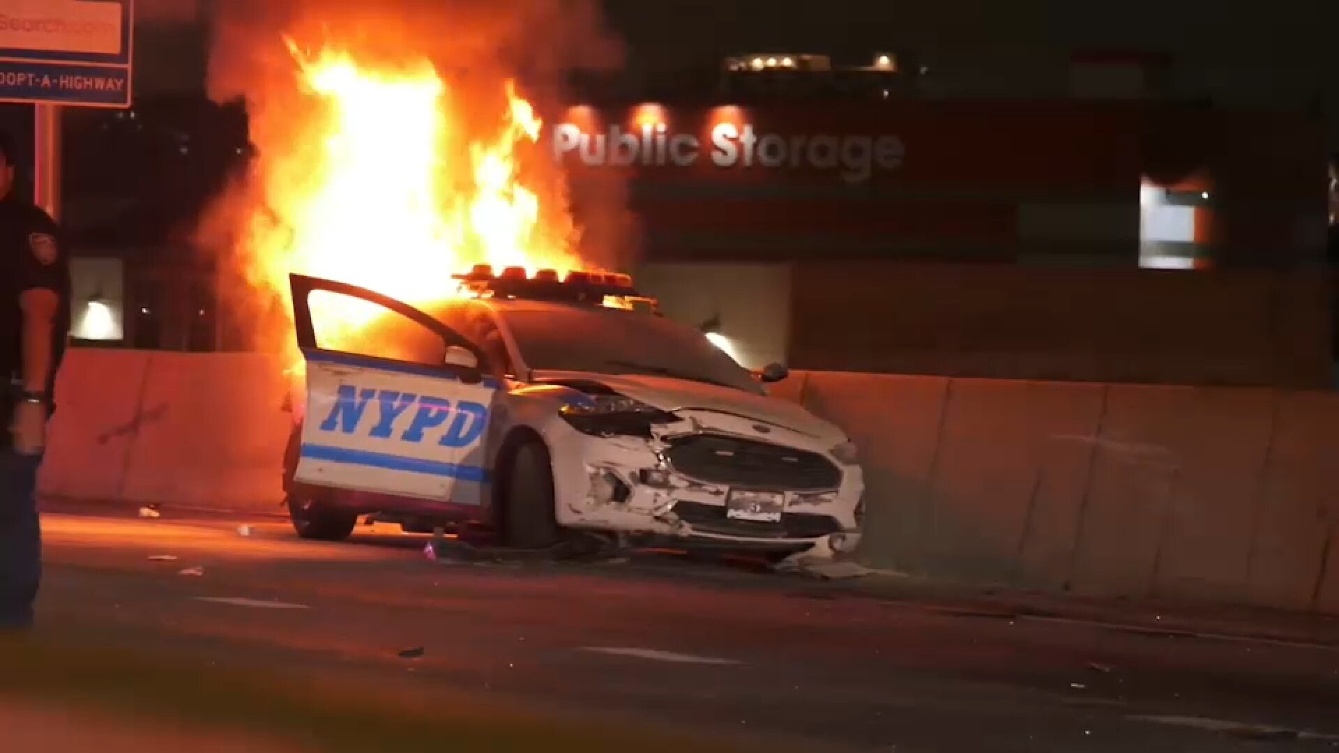 Driver hits NYPD cruiser, causing it to overturn and burst into flames on Bruckner Expressway
