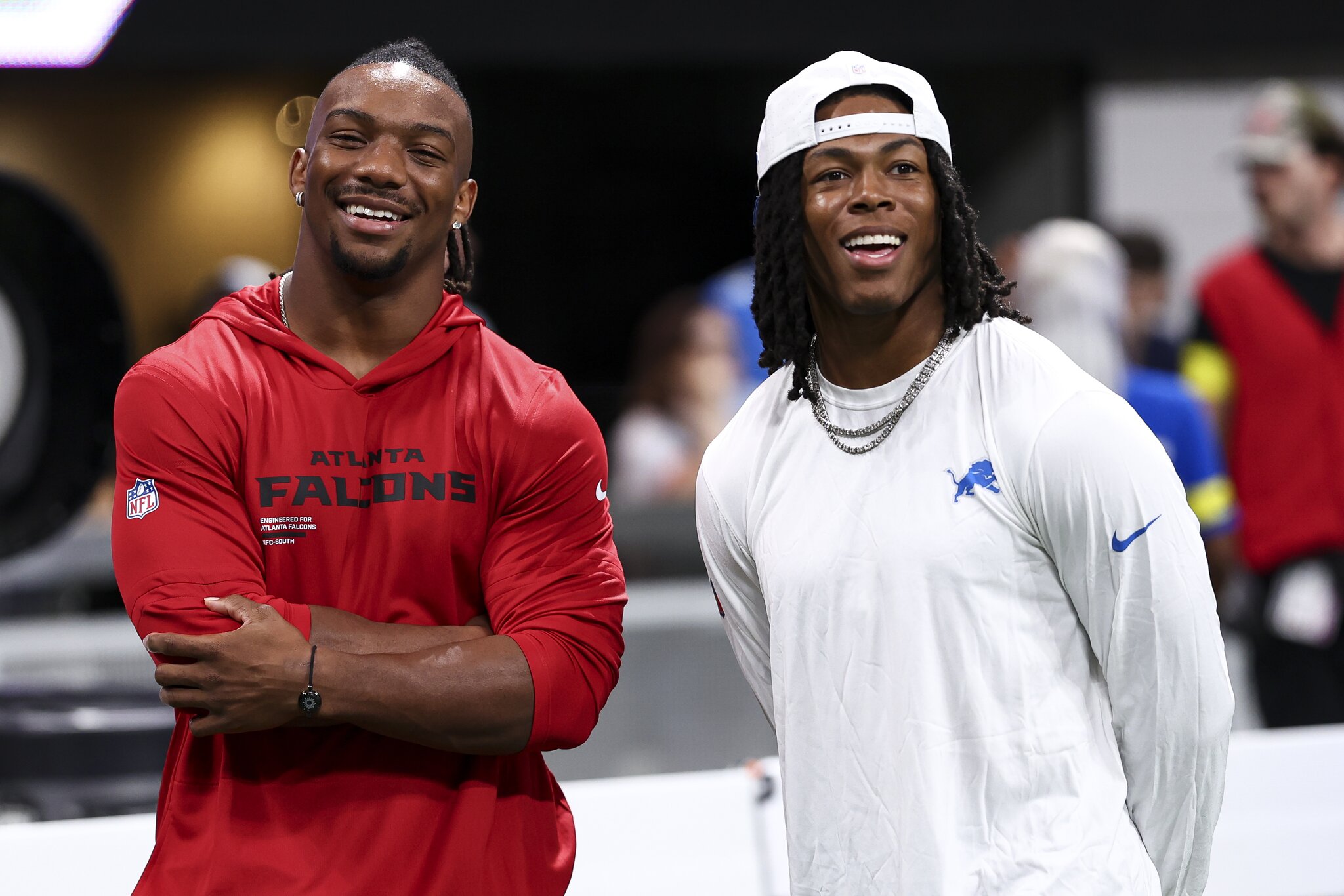 Bijan Robinson and Jahmyr Gibbs not participating in practice as they seek market-changing new contracts