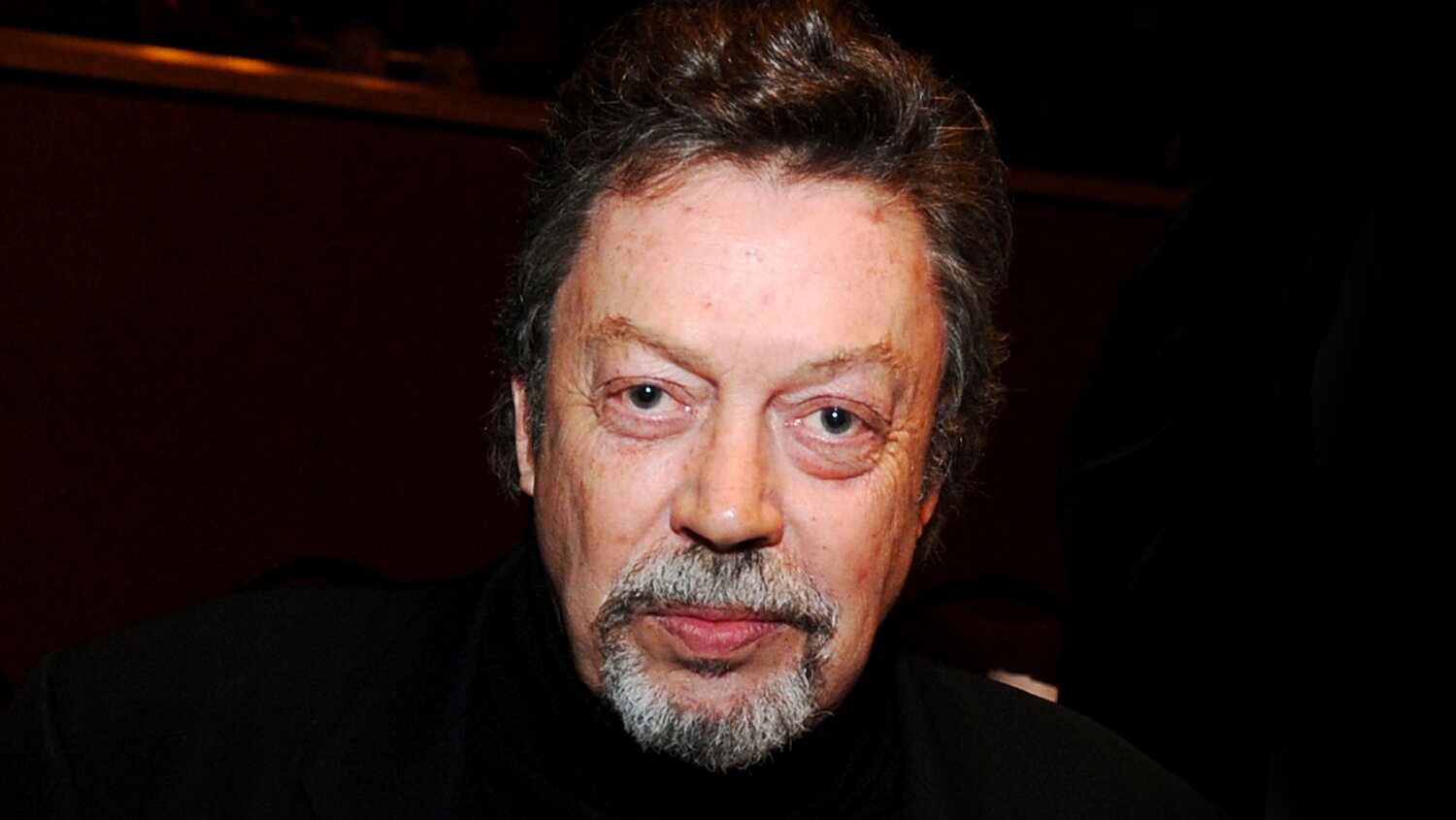 Luke Evans, ‘Clue’ Stars, Carol Burnett, Josh Gad & More Pay Tribute To Tim Curry