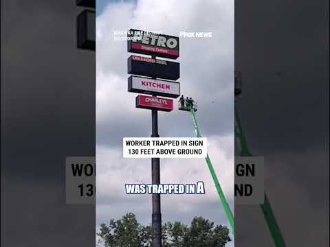 Worker rescued after being TRAPPED in sign 130 feet above ground #shorts #us #news