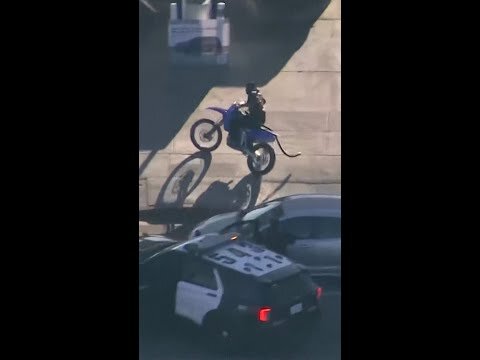 Dirt bike rider stops for gas during police chase