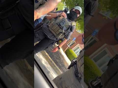 ICE agent points gun at woman in video that conflicts with gov’s narrative