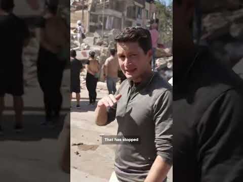 Rescue teams scramble to free people trapped in rubble
