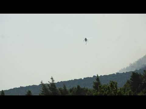 Aerial firefighters tackle wildfires in Greece