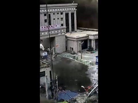 People try to flee as mudslide engulfs a border crossing