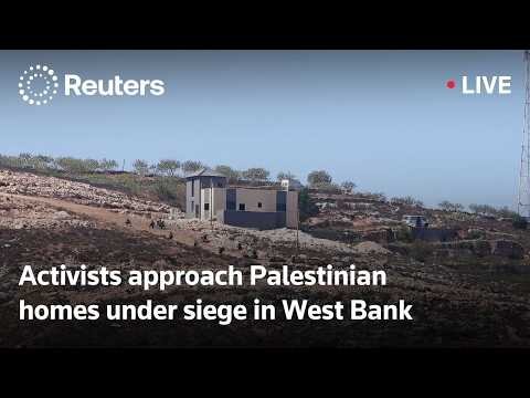 Group of activists approach Palestinian homes under siege