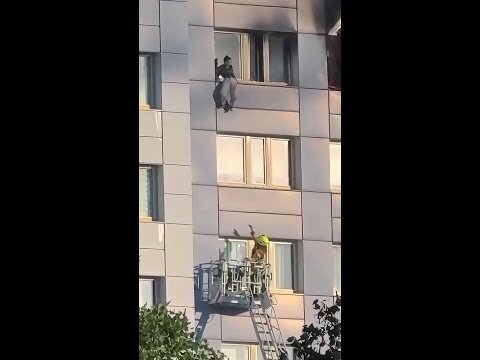 Woman jumps from burning high-rise building in Germany