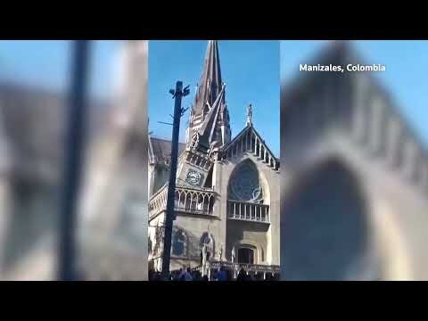 People run from falling debris after Colombia earthquake