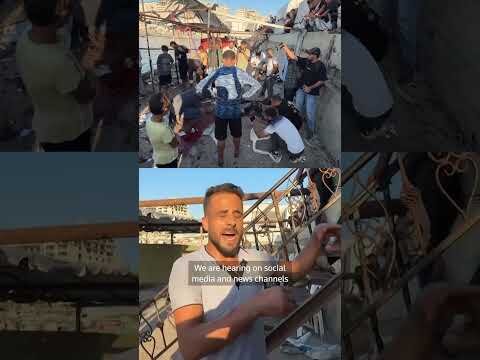 WARNING: GRAPHIC CONTENT - Palestinians inspect aftermath of deadly Israeli strike