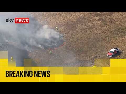 Firefighters tackle wildfires across east of England