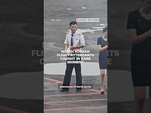 North Korean flight attendants caught in rare moment