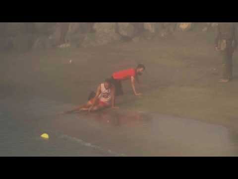 Exhausted migrants collapse on Ceuta beach