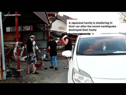 Japanese family shelters in car days after earthquake