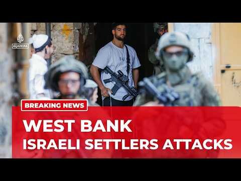 Dozens of settlers escorted by Israeli forces have attacked Palestinians north of Ramallah