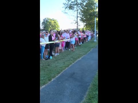 Dozens gather at a silent rally in support of Clancy