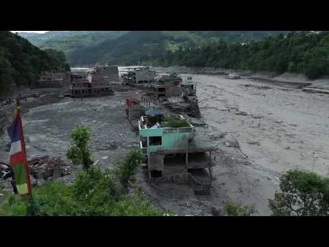Turquoise house stands firm amid deadly Nepal floods