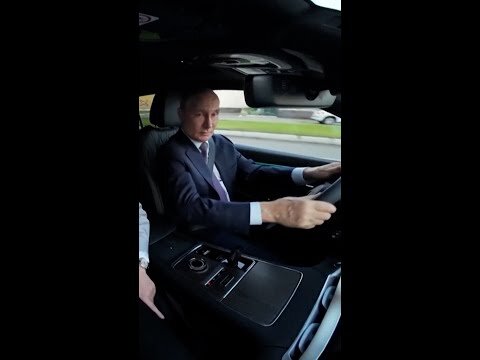 Putin takes new Volga SUV for test drive at factory
