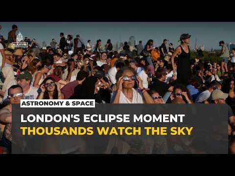 Thousands gather in London to watch rare partial solar eclipse