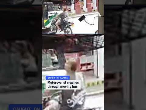 Motorcyclist crashes through moving bus