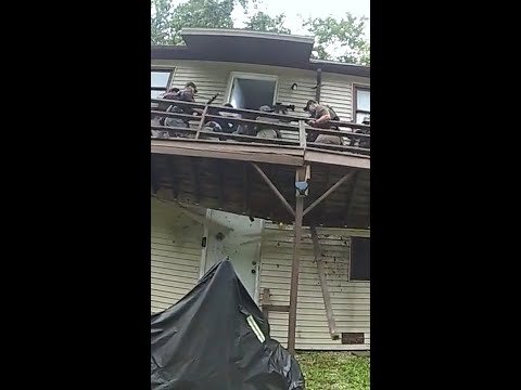 U.S. Marshals fall during SWAT raid when porch gives way