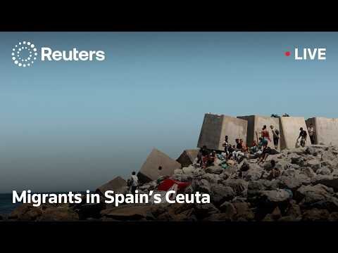 Migrants camp at a beach in Spain's Ceuta