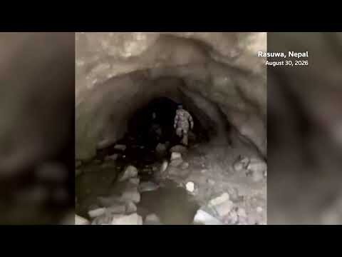 Rescuers race to reach hundreds trapped in Nepal tunnels