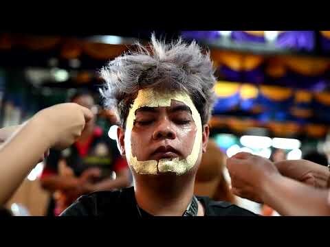 Thais flock to get a face-blessing ritual amid economic hardships
