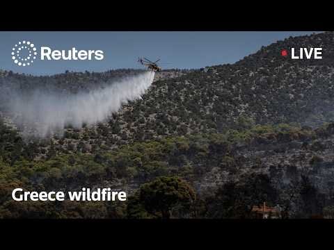Firefighters battle raging wildfires in Greece