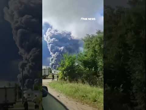 Thick smoke RISES after reported Ukrainian drone attack on Russian warehouse #shorts #us #news