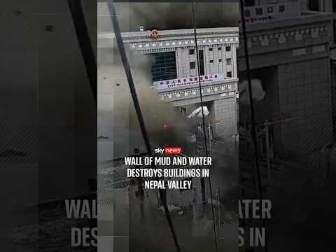 Wall of mud and water destroys buildings in Nepal valley
