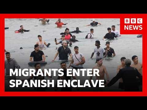 Thousands of migrants try to enter Spanish enclave of Ceuta from Morocco