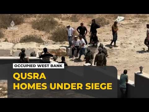 Israeli settlers besiege Palestinian homes in occupied West Bank