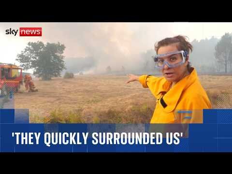 Sky reporter and firefighters surrounded by flames as wildfires spread across France