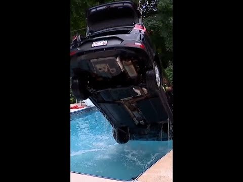 Car crashes into a swimming pool after the brakes fail