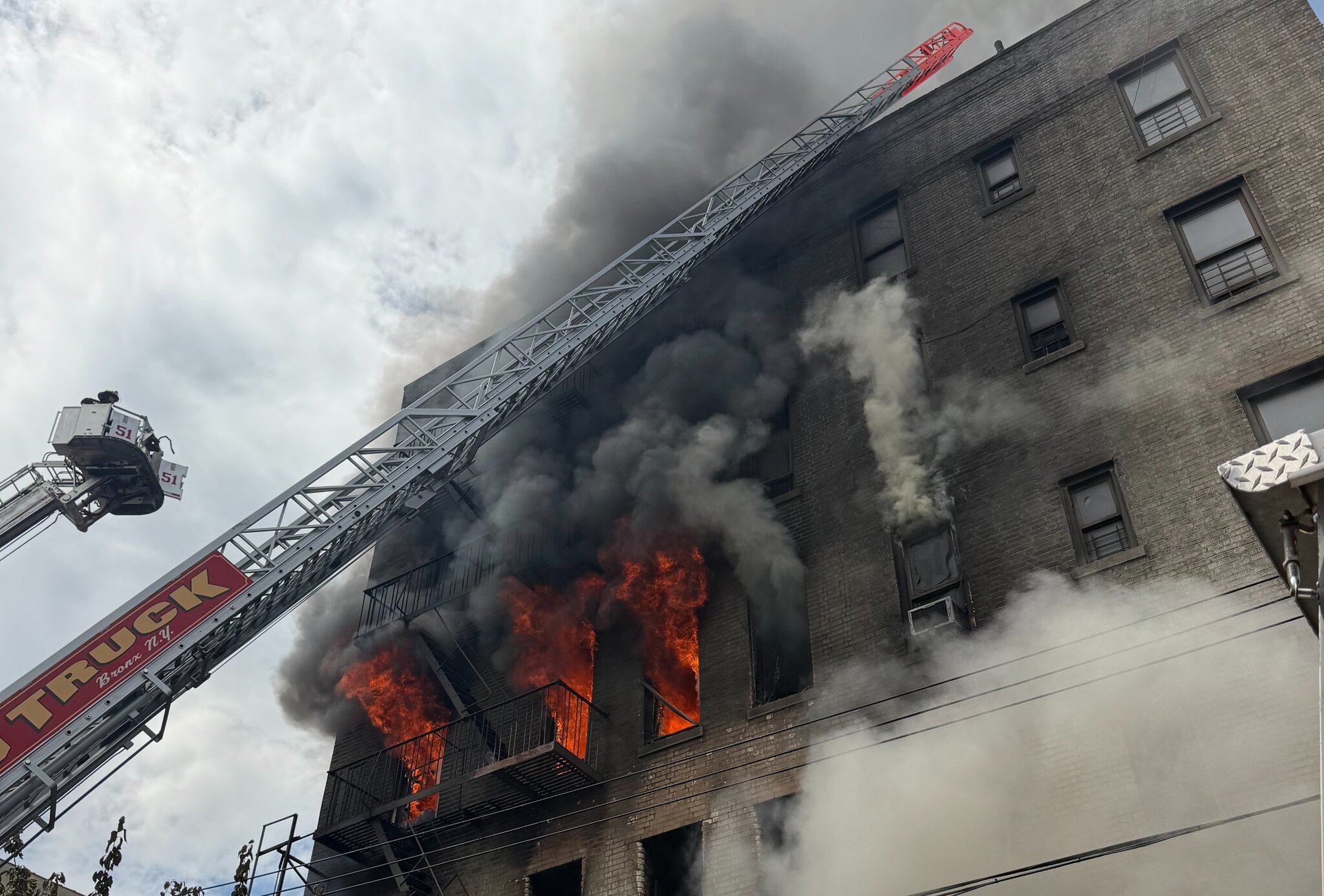 1 dead, 14 injured in 5-alarm Bronx apartment fire after reported explosion