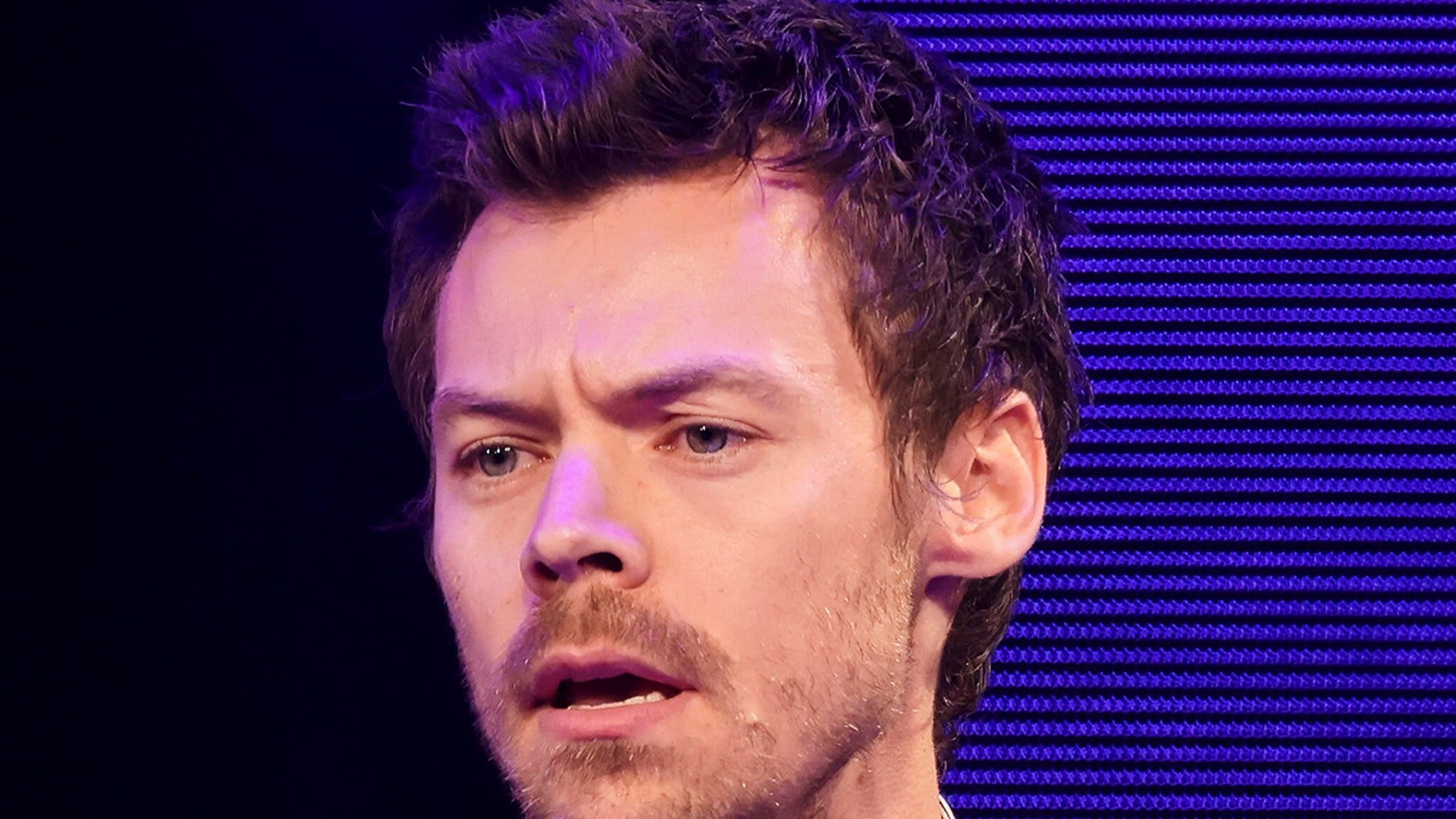 Harry Styles Seems Concerned After Fan Ditches Baby To Beg for Photo