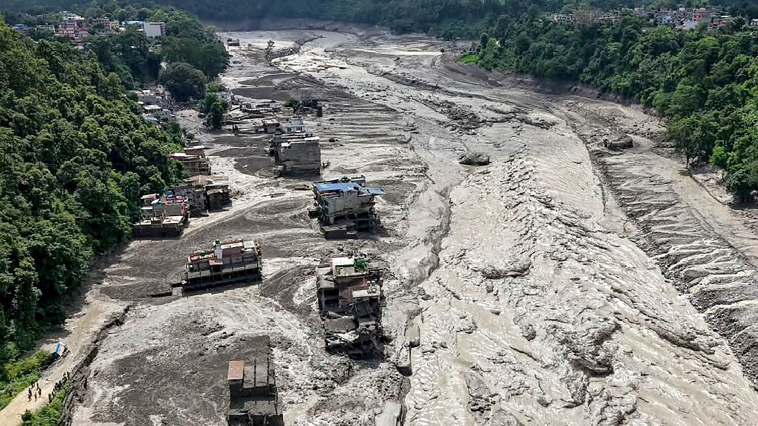 Nepal search efforts underway in difficult terrain of flooded Himalayan foothills