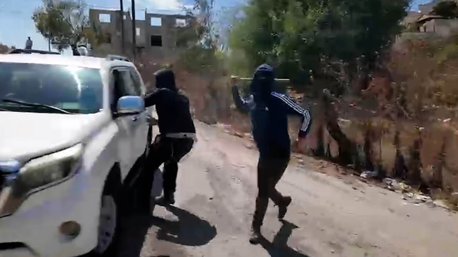 Palestinian woman and NBC News team attacked by masked Israeli settlers