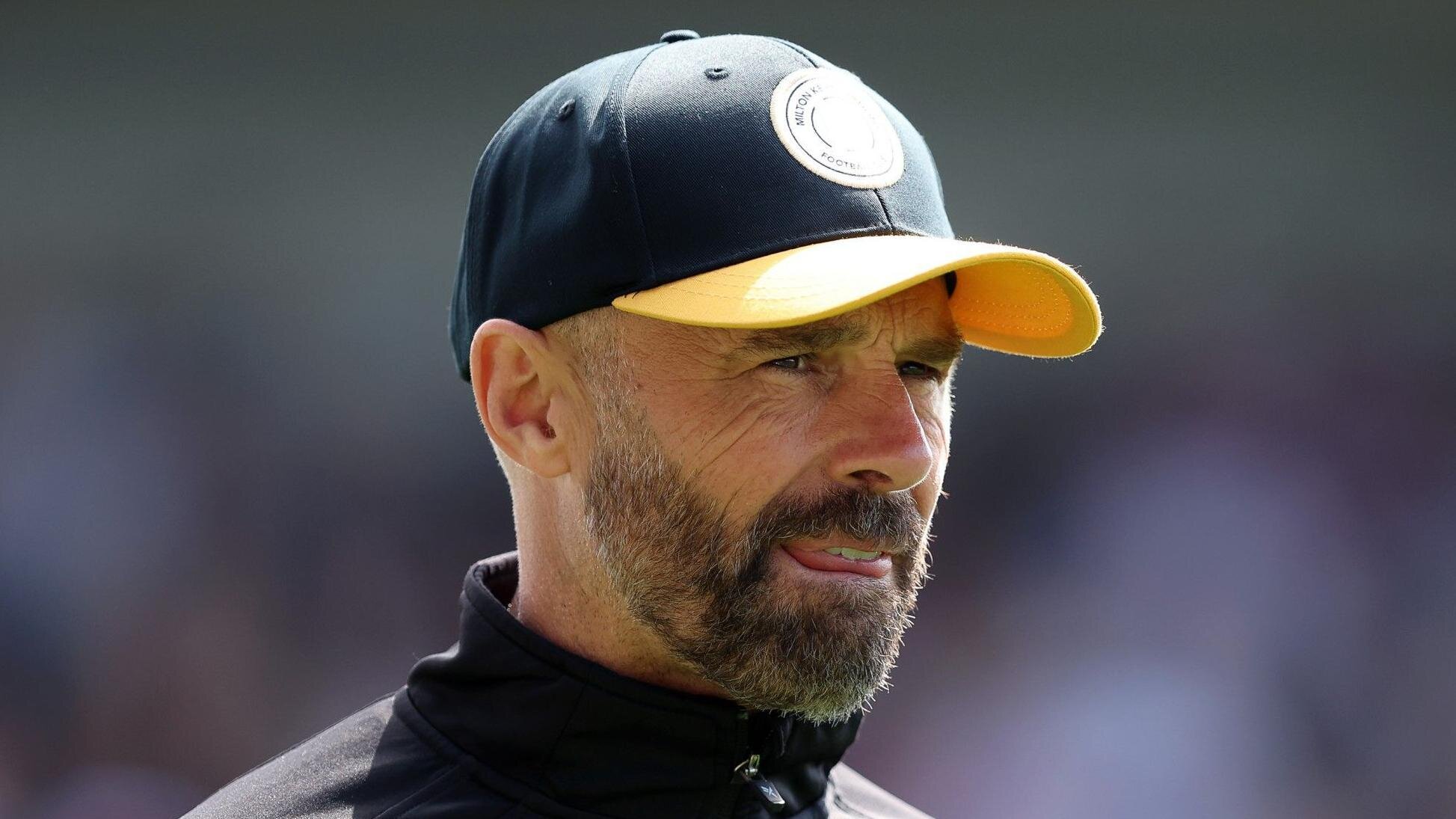 MK Dons boss Warne embraces promotion bid pressure