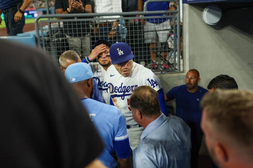 Dodgers' Freddie Freeman appears to avoid serious injury in fall down dugout steps