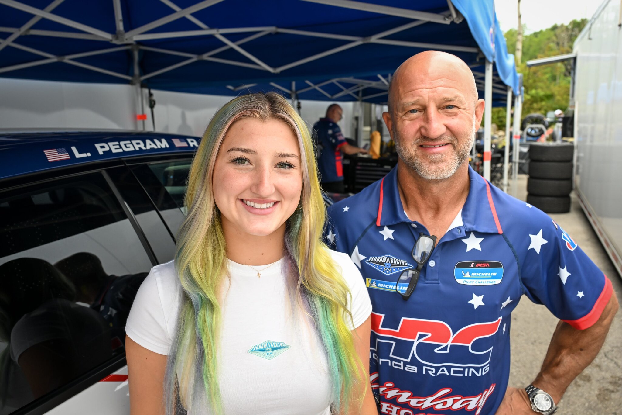 A Superbike winner and his daughter navigate racing sports cars together