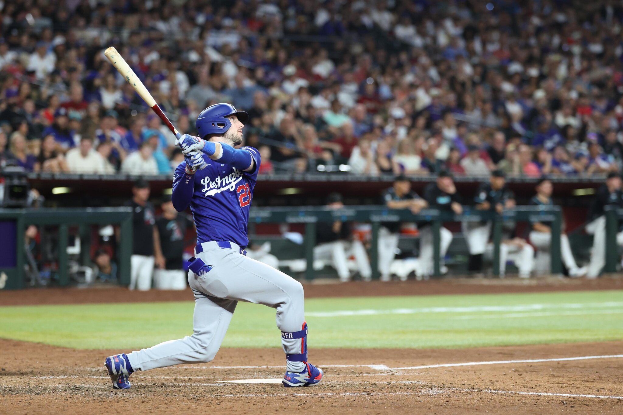 Dodgers need extra innings to snap their seven-game losing streak