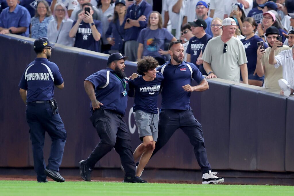 Scene at Yankee Stadium turns dangerous as 3 fans ran onto the field at the same time